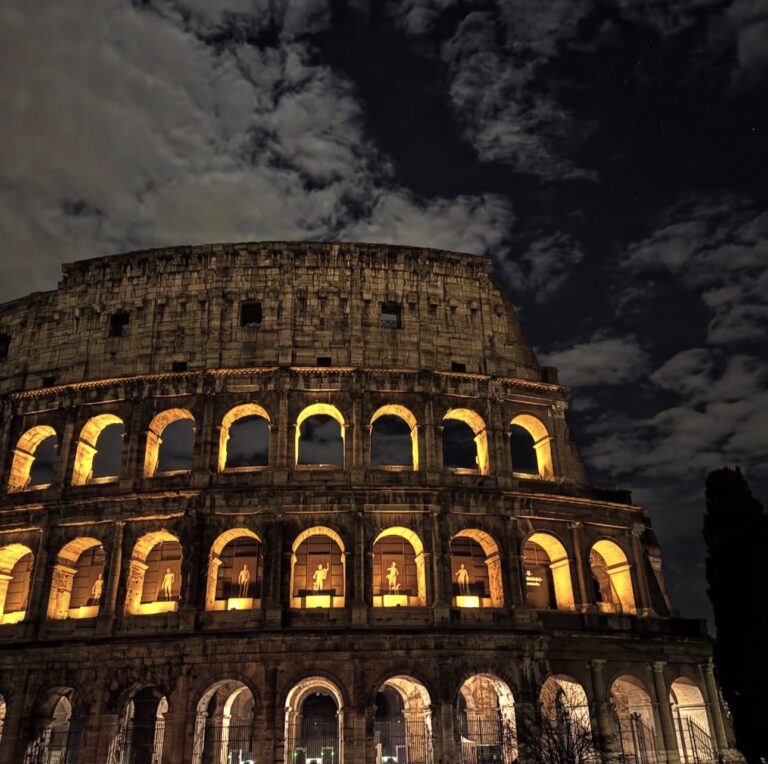 The Colosseum lit up at night in Rome
