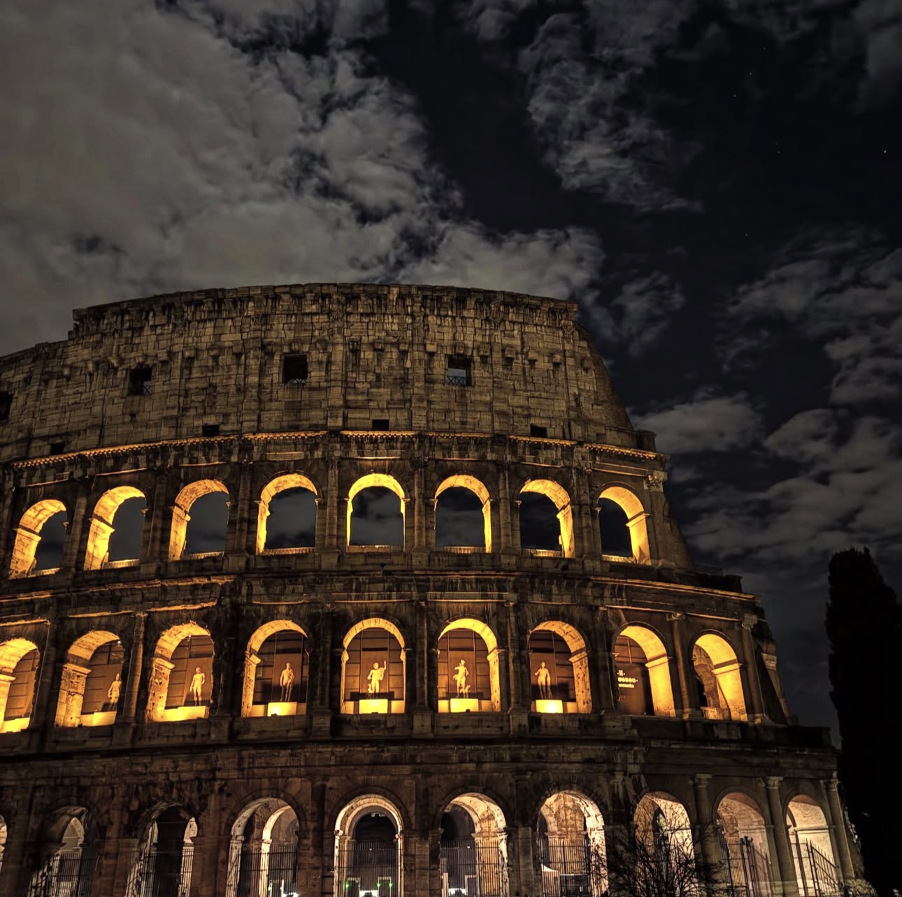The Colosseum lit up at night in Rome
